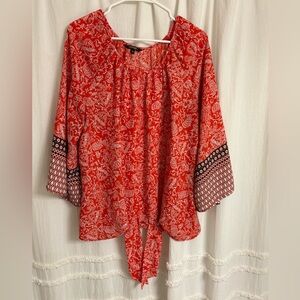 Long sleeve top. Flowy. ties in the front. With bell sleeves.